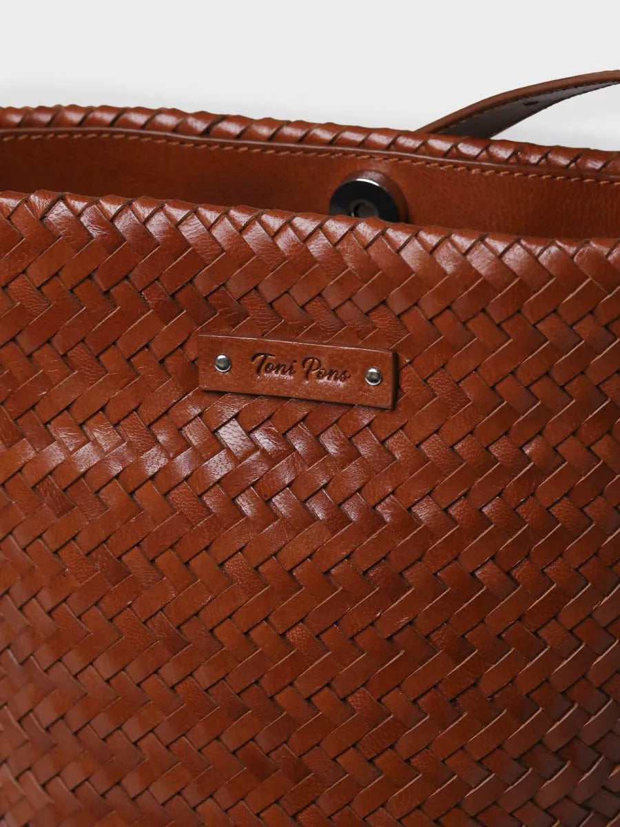 Complementos - Bolso bombonera en cuero trenzado con tira ajustable | SALLY - Toni Pons