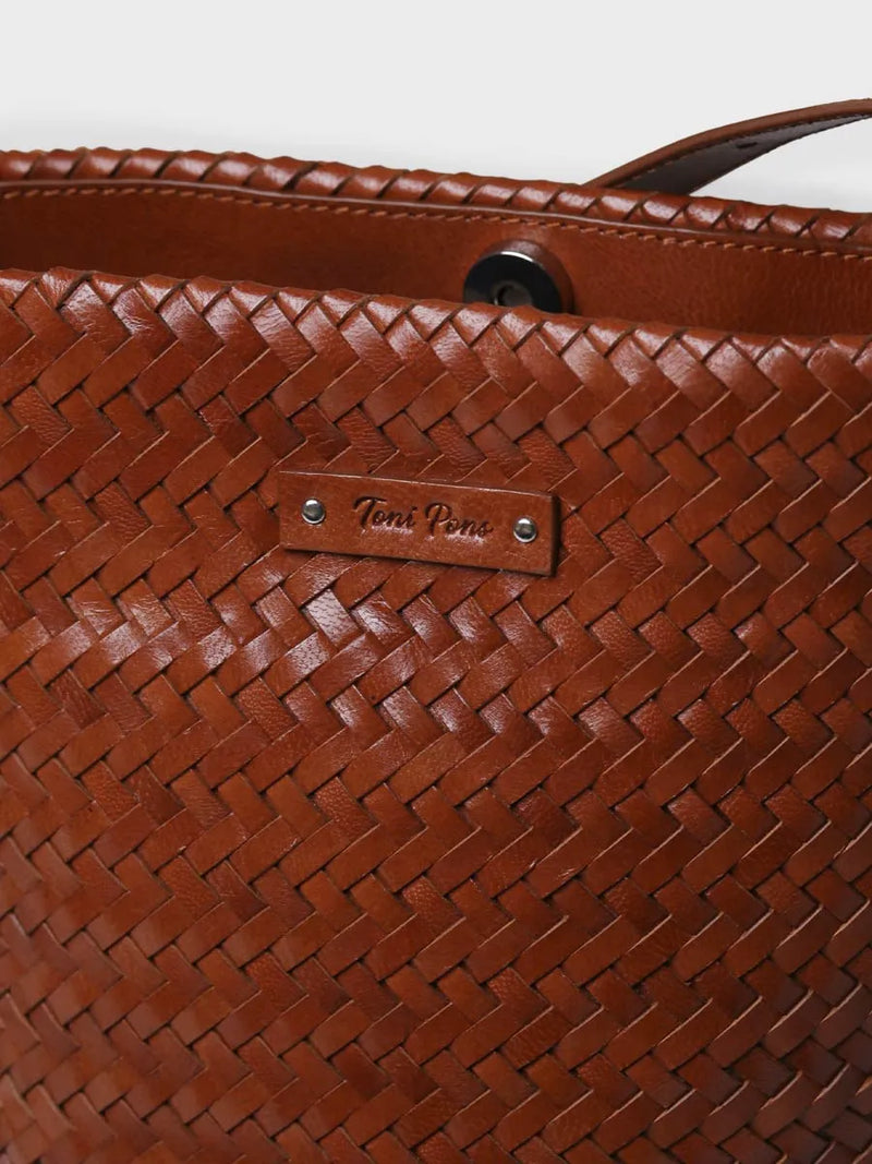 Complementos - Bolso bombonera en cuero trenzado con tira ajustable | SALLY  - Toni Pons  